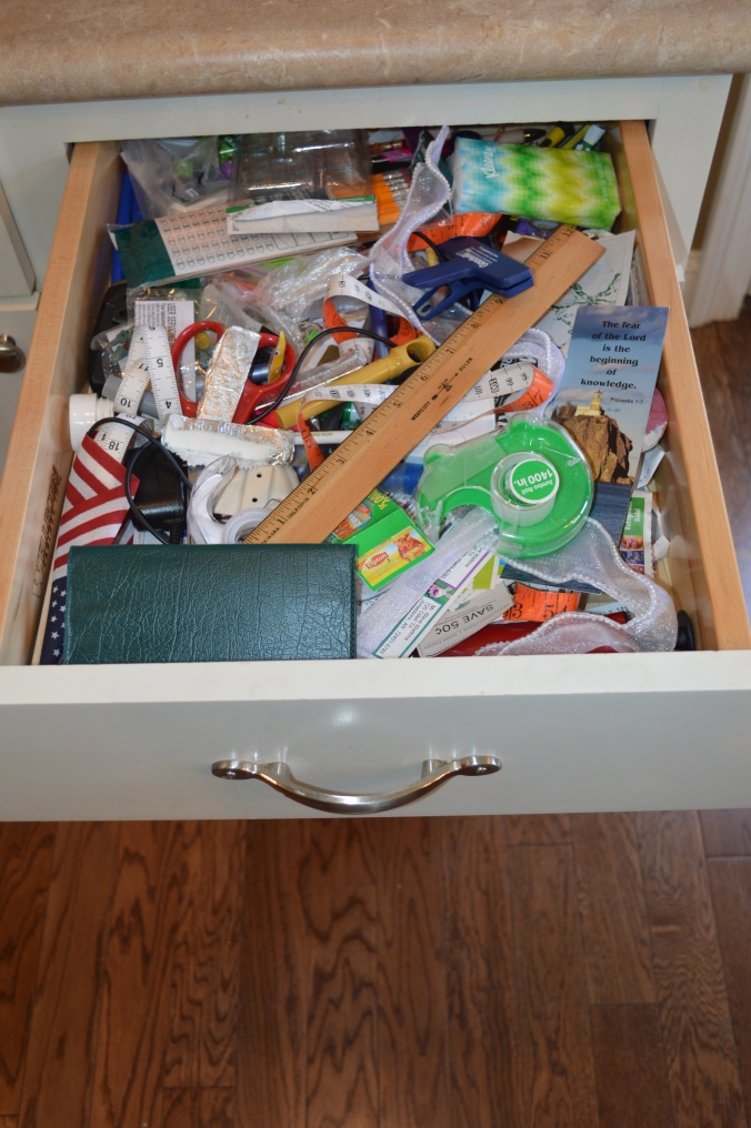 Our primary junk drawer in all its glory.